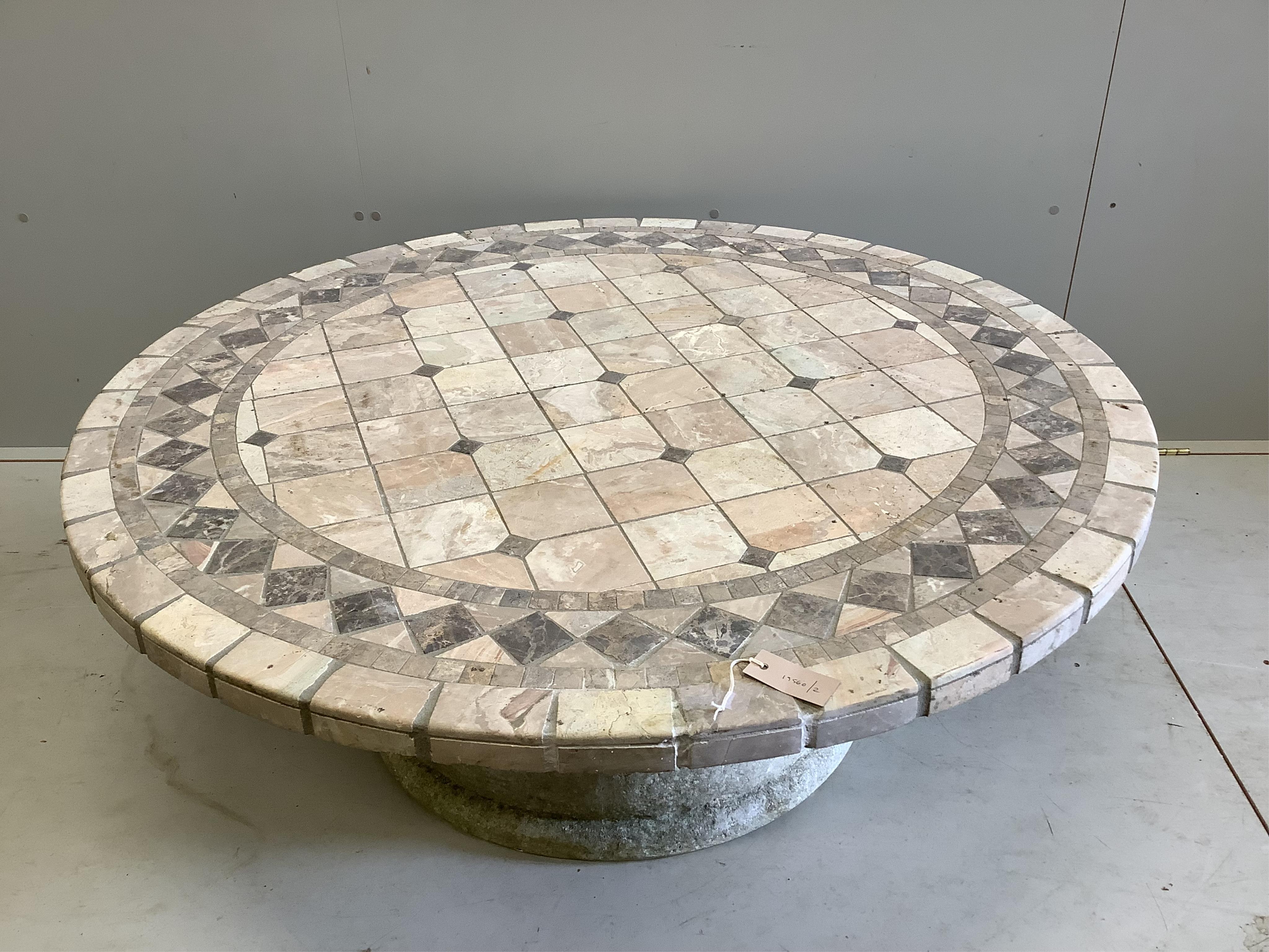 A hardstone mosaic top coffee table with reconstituted stone base, diameter 121cm, height 47cm. Condition - fair